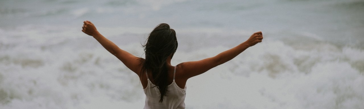 Woman holding out arms in freedom. When you can be in control of who you are life is better. Learn how online therapy in Florida can help you with anxiety, depression, stress, relationships, and more. Begin working with an online therapist soon!
