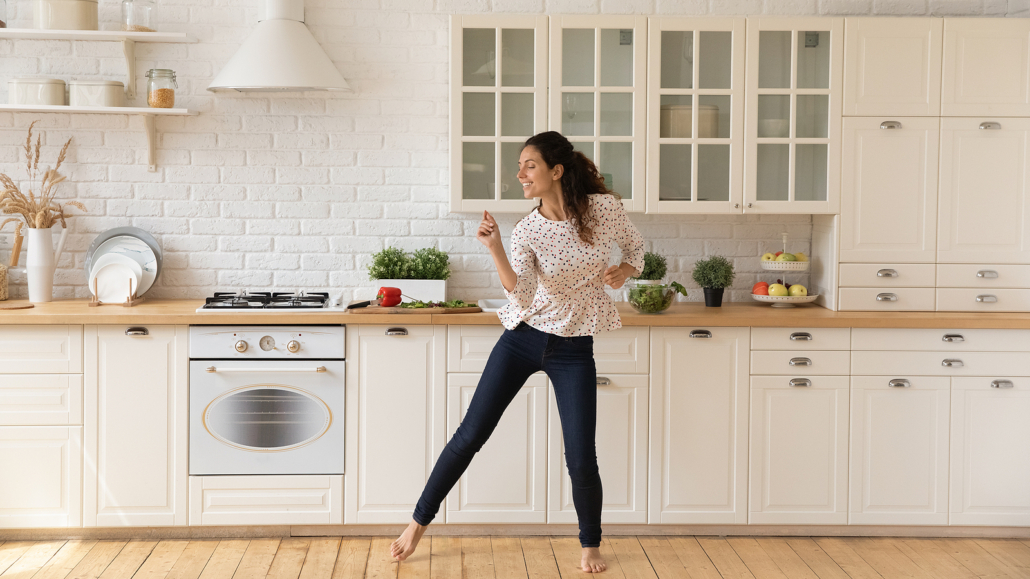 Woman in kitchen dancing. Finding freedom for yourself and your family is something to celebrate. Get eating disorder help from an eating disorder therapist here. Call now and see what eating disorder support in Brevard county, FL our online therapists in Florida can offer!