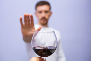 Man holding hand out to wine glass to say no. Let's overcome this together. Get support for substance abuse in Brevard County, FL. Our online therapists can help you with the anxiety, work stress, depression, trauma, and more. Begin substance abuse counseling in Florida.