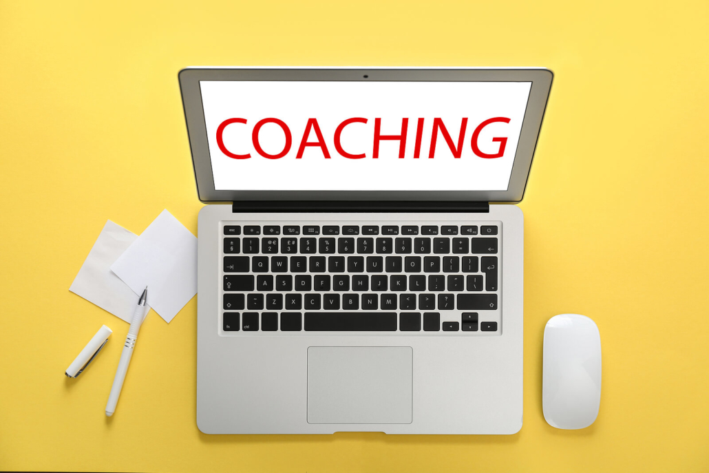 Computer with coaching on screen against yellow background. Call now and talk with an online life coach who offers coaching for women. Out coaches are here to support you. Try authenticity coaching, self-love coaching, coaching for chronic pain, or our untamed program. Learn more and begin online life coaching soon!
