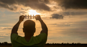 Image of a man holding up a cut out of 4 figures strung together in front of a sunset. If you are searching for addictions counseling online therapy in Florida might be right for you. We offer therapy for adults in Brevard County, FL. Contact us today to start substance abuse counseling in Florida. Winter Park 32789 | Naples 34103