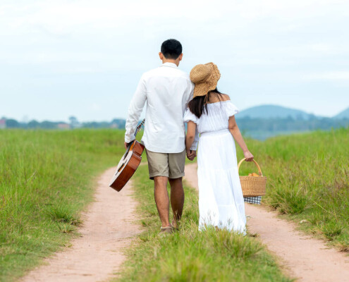 Couple walking alongside path. Needing support is ok. When you are experiencing the four horsemen of the apocolypse, marriage counseling and couples therapy can help. Begin gottman therapy in Florida for support!