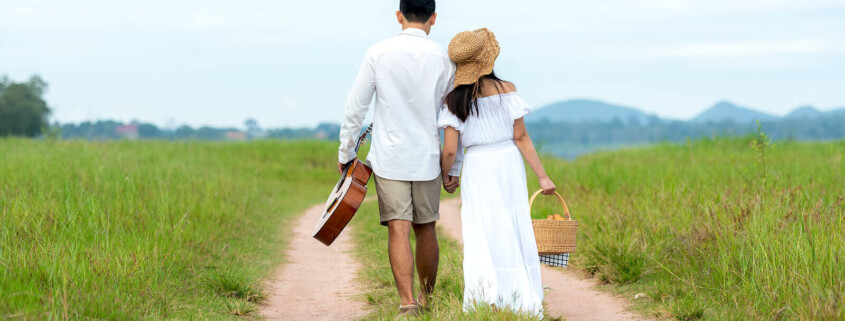 Couple walking alongside path. Needing support is ok. When you are experiencing the four horsemen of the apocolypse, marriage counseling and couples therapy can help. Begin gottman therapy in Florida for support!