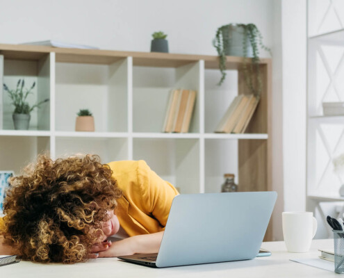 Exhausted working woman. Are you ready for a change? Learn how to deal with stress at work. Stress therapy in Florida can give you better coping skills for stress. Call now and see how we can help Via online therapy!