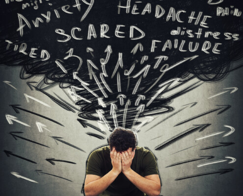 A man sits while covering his face with scattered thoughts above him including "anxiety, depression, scared, failure" and more. Learn how a trauma therapist in Florida can offer support in addressing repressed emotions. Learn more about stress therapy in Florida and more today.