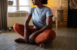 A woman sits on the floor while meditating. Learn how an online therapist in Brevard County, FL can help cultivate peace of mind. Contact a marriage counselor in Brevard County, FL to learn more about individual therapy in Brevard County, FL, and other services. 