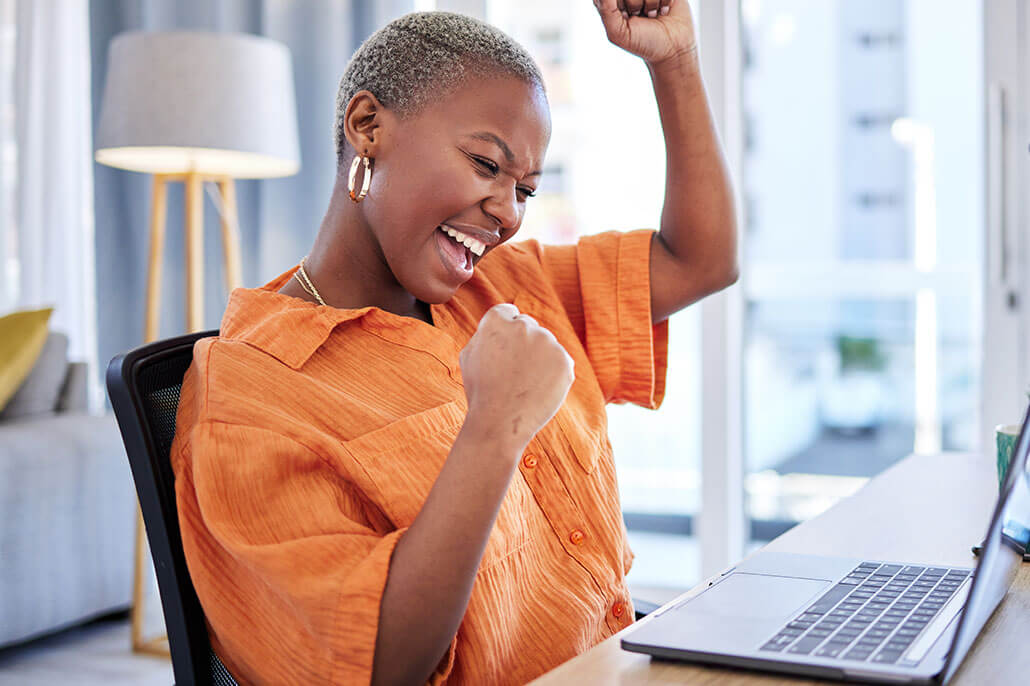 Excited woman having an online coaching session