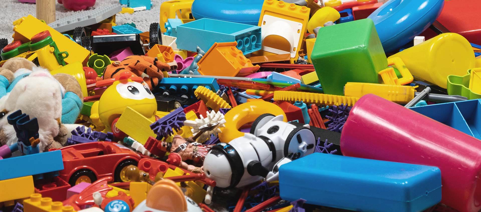 Colorful toys littered on the floor. When your child is dealing with mental health issues such as trauma, a play therapist can help. Learn how therapy for child can assist them or consider online play therapy in Florida today!
