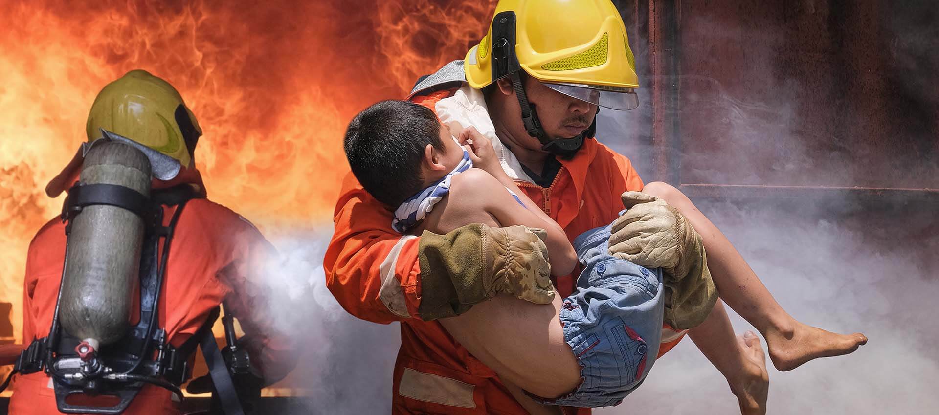 First responder carry a small child out of a firey scene. When you're worried about your spouse, stress, anxiety, and secondary trauma may arise. Why not get support in therapy for spouses of first responders in Florida today for relief. Call now and begin online therapy.