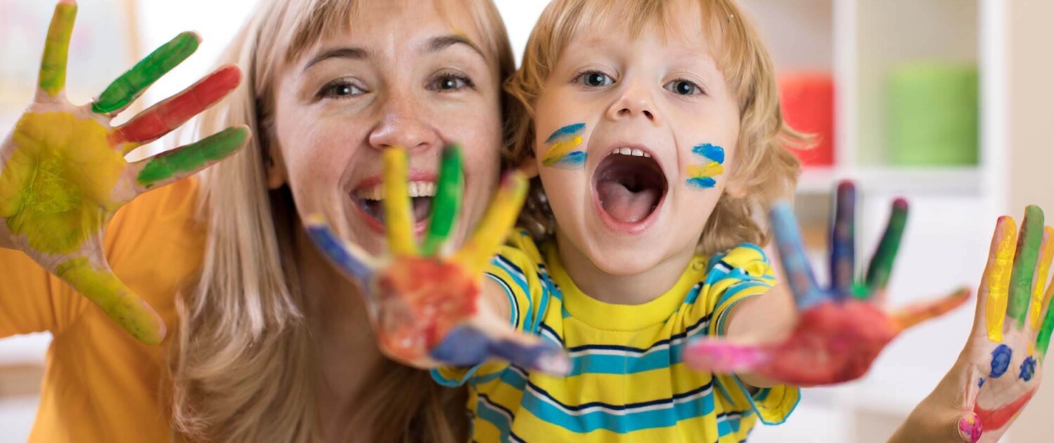 Mom and child painting. Begin therapy for children in Florida to help your child with anxiety, depression, trauma, and more. Work with a skilled play therapist today for guidance.