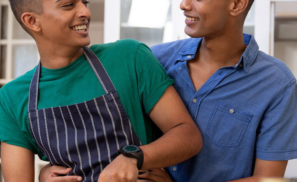 Gay couple laughing and making dinner. When you’re seeing a family memeber struggling with eating disorders, getting eating disorder help matters. If you as a family need support try eating disorder support in Brevard County, FL for families. Call now and beginning coping with anxiety, stress, and more!
