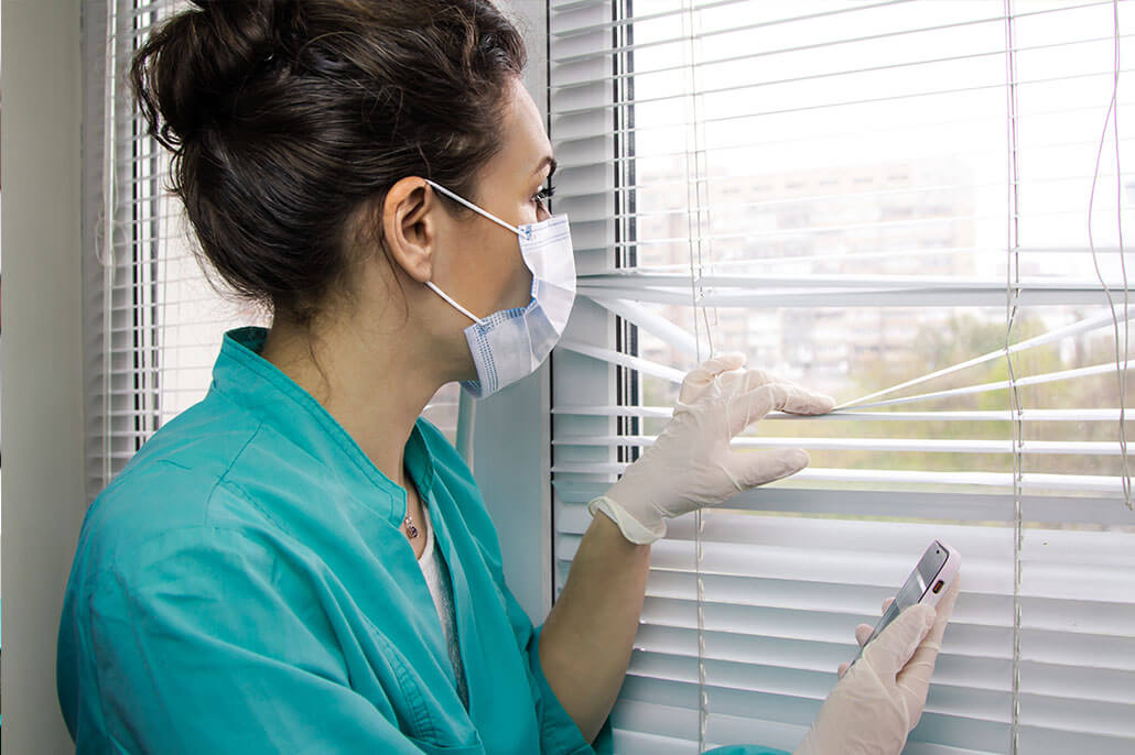 Nurse in scrubs and mask looking out window. We know that being in a high tension field takes a toll on you at times. Get help with therapy for first responders in Brevard County, FL today!. You will work with therapists specializing in therapy for first responders.