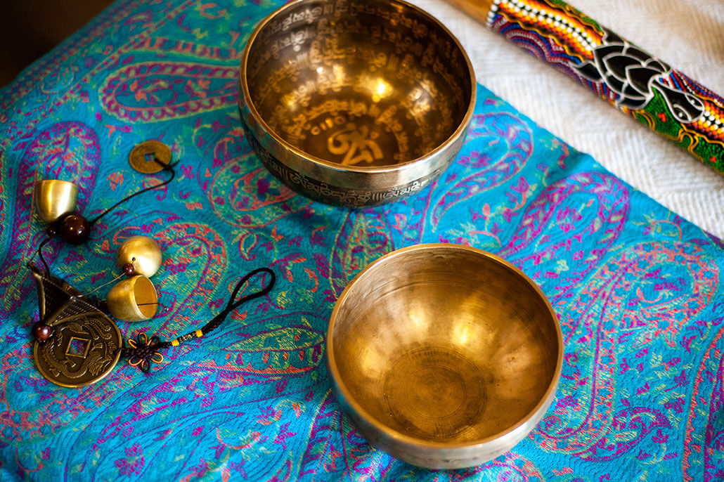 Metal sound bowls on a colorful embroidered cloth