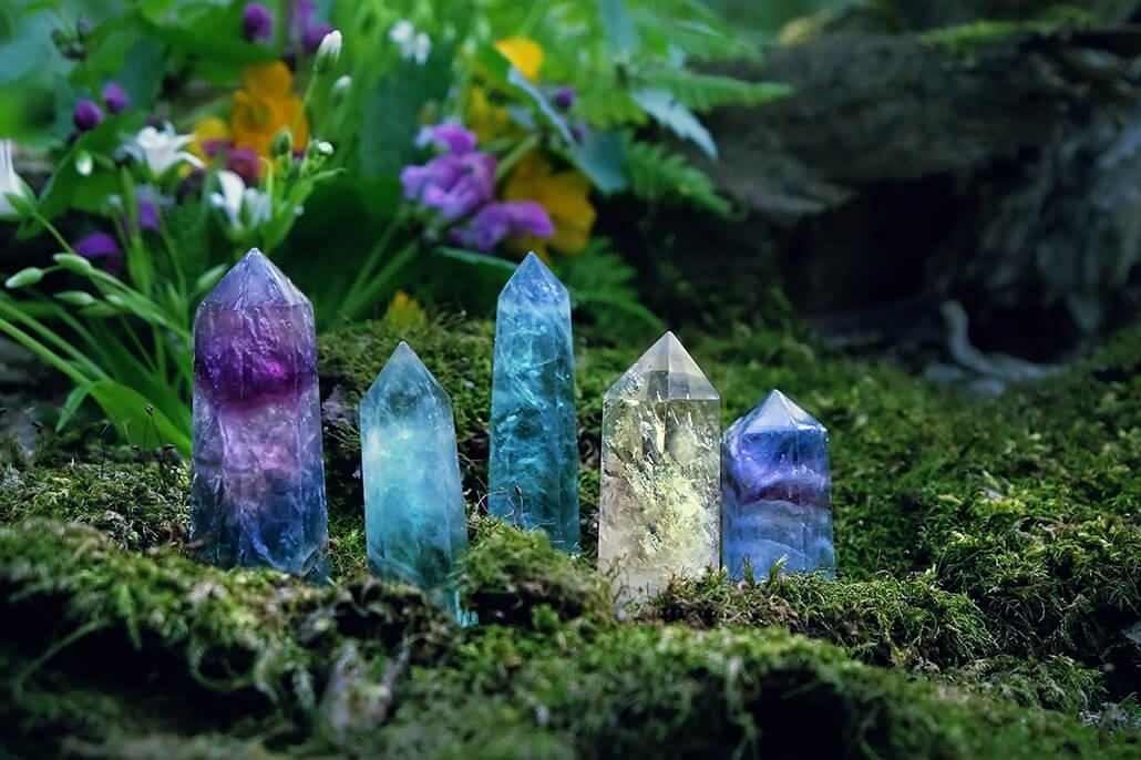 Beautiful healing crystals sitting on a mossy forest knoll