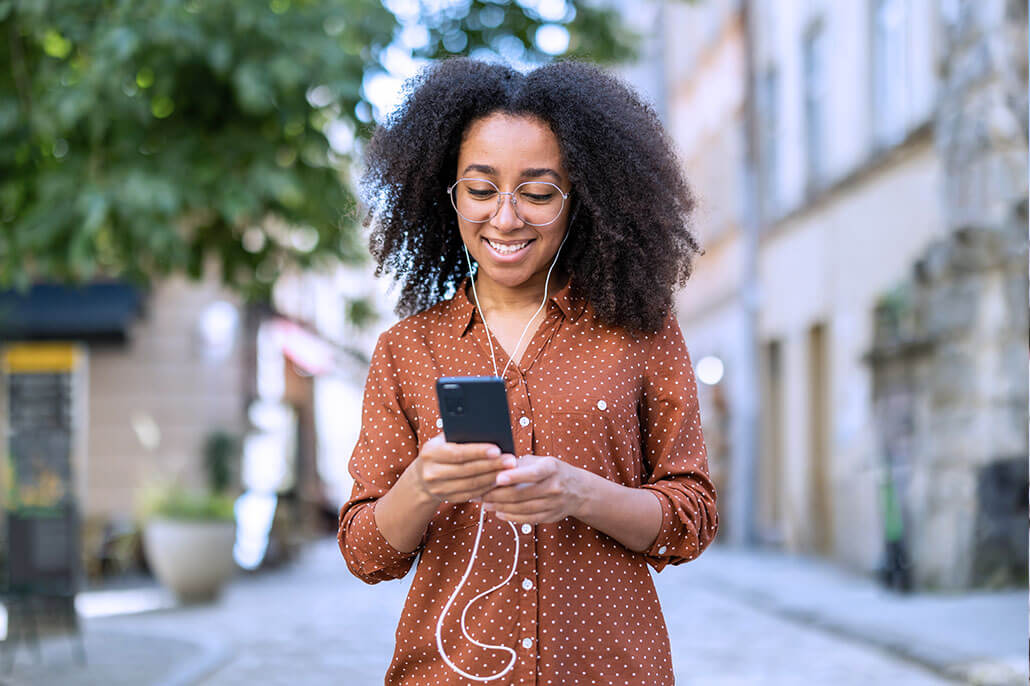 Diverse urban woman in florida representing having a walk and talk therapy session over the phone