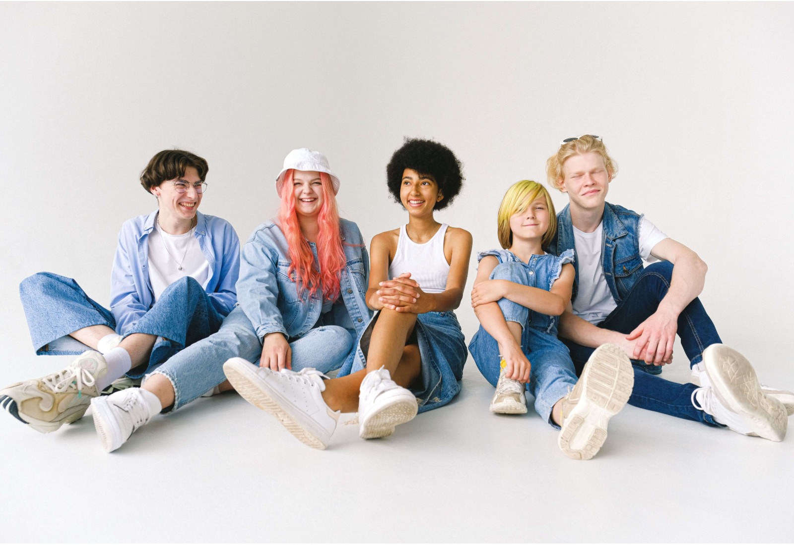 Five teens sit together on the floor, laughing and relaxed. After-school restraint collapse can look very different from how a teen presents around friends or in public. Therapy for anxiety and stress in Merritt Island, FL supports teens in processing what they hold in during the day.